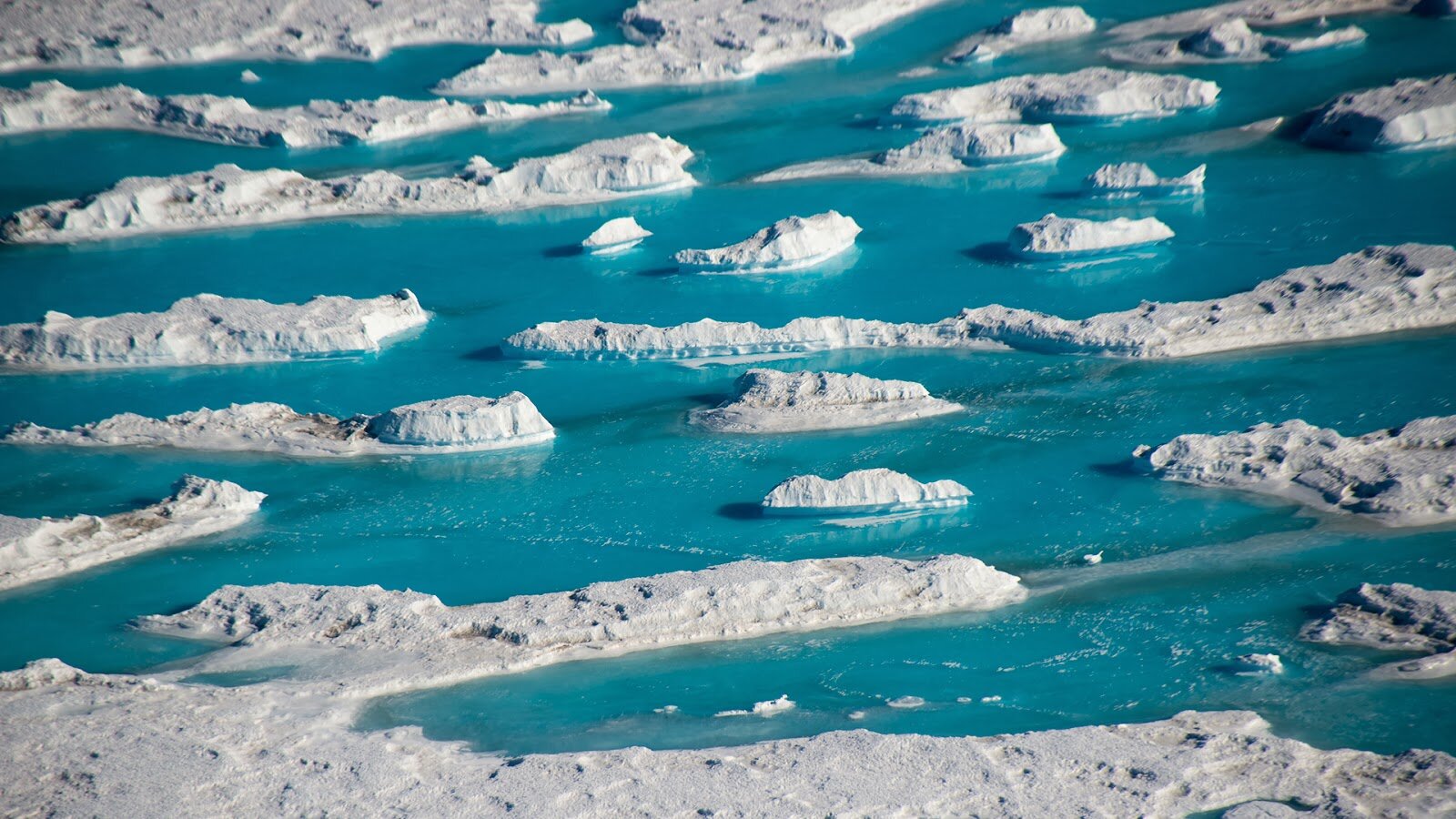 Meltwater on the ice shelf next to McMurdo Station. Photo: Nicholas Bayou/ UNAVCO