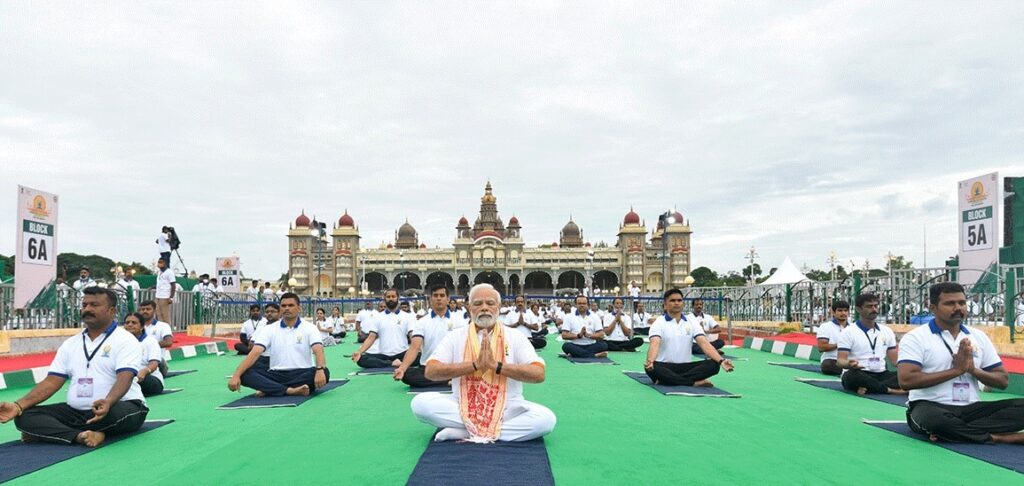 A group of men in a lotus position - practicing yoga. 
