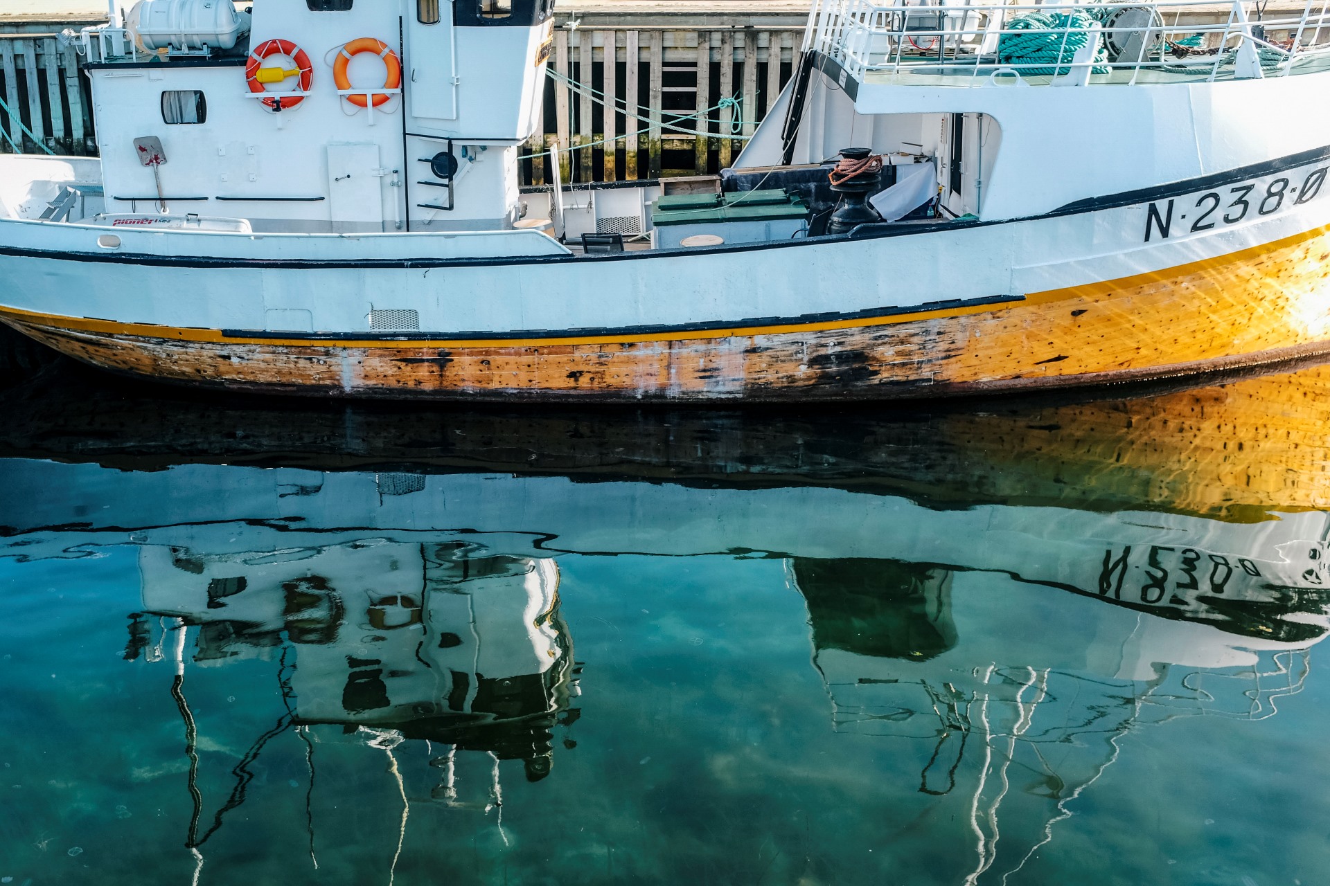 A fishing boat by the water - a proof of Sortland's rising water levels. 