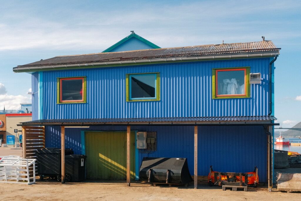 A photo of blue waterside building in Sortland.